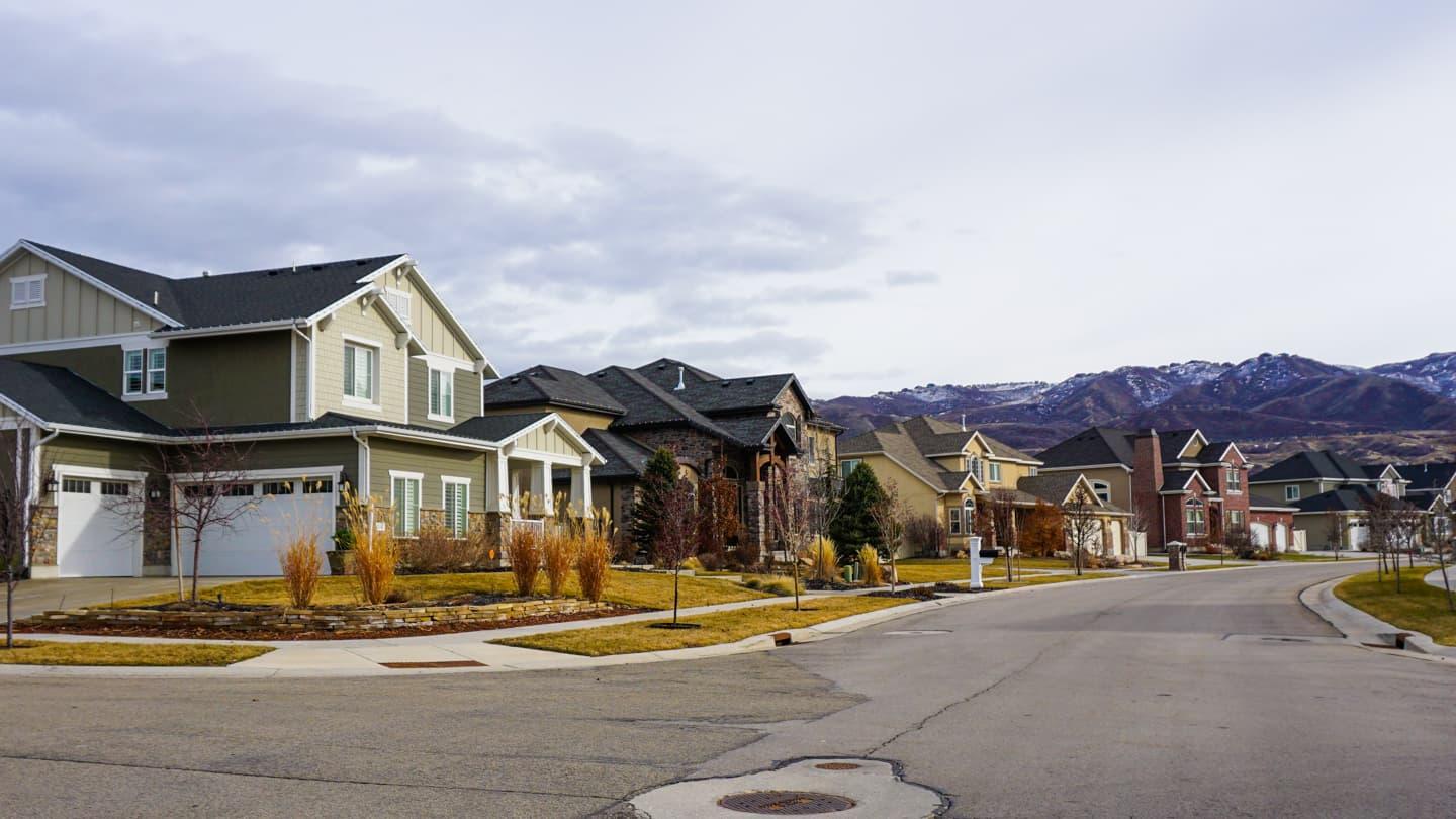 Northern Utah neighborhood with snowcapped mountains in the background